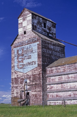 Logo on wooden grain elevator at Handsworth, Saskatchewan