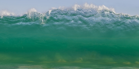 Wall of water getting ready to crash on the beach at Buzzards beach bar, La Laguna, near San Jose del Cabo, Baja, Mexico.