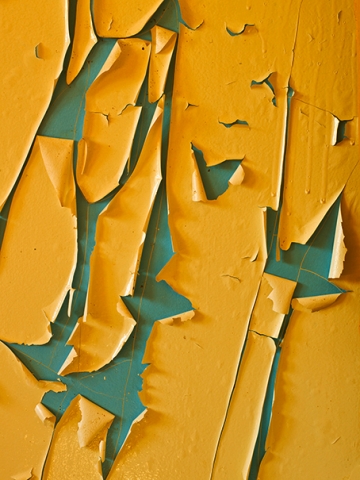 Flaking paint layers, abstract, close up of old painted wall.