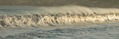 Ocean waves, seascapes, sandy beaches, blues and greens , foam and wave spray,  rolling waves, see through waves.