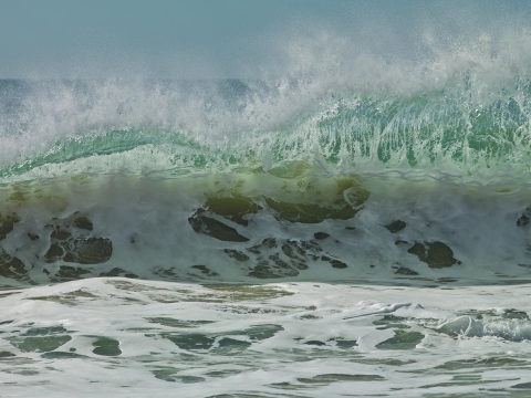 Ocean waves, seascapes, sandy beaches, blues and greens , foam and wave spray,  rolling waves, see through waves.