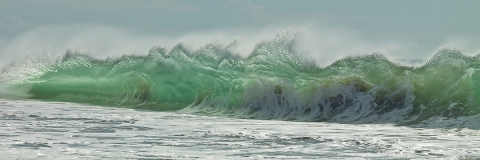 Ocean waves, seascapes, sandy beaches, blues and greens , foam and wave spray,  rolling waves, see through waves.