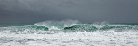 Ocean waves, stormy seascapes, sandy beaches, blues and greens , foam and wave spray,  rolling waves, see through waves, black storm clouds, hurricane Baja waves, Mexican seascapes.