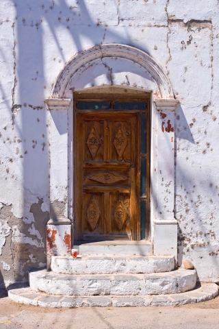 Wooden door with steps in San Ignacio