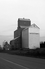 Photograph of wooden grain elevator at Mayerthorpe, Alberta