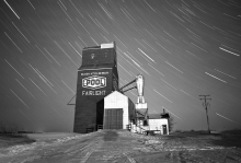 B+W photo of Wooden grain elevator, night photography, winter, snow