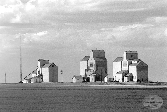 Watercolour of old grain wooden elevators at Skiff, Alberta