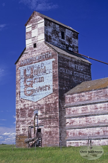 Logo on wooden grain elevator at Handsworth, Saskatchewan