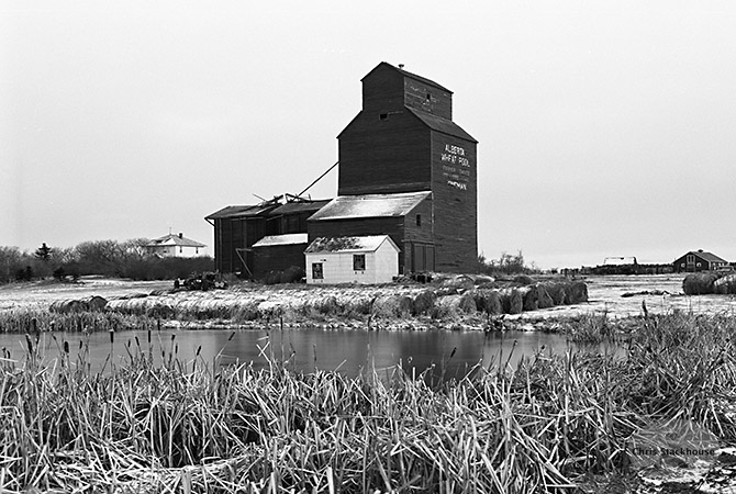 Image of wooden grain elevator from Kingman, Alberta