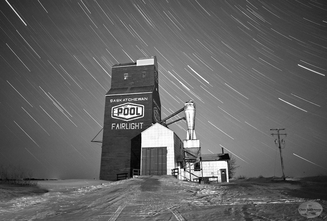 B+W photo of Wooden grain elevator, night photography, winter, snow